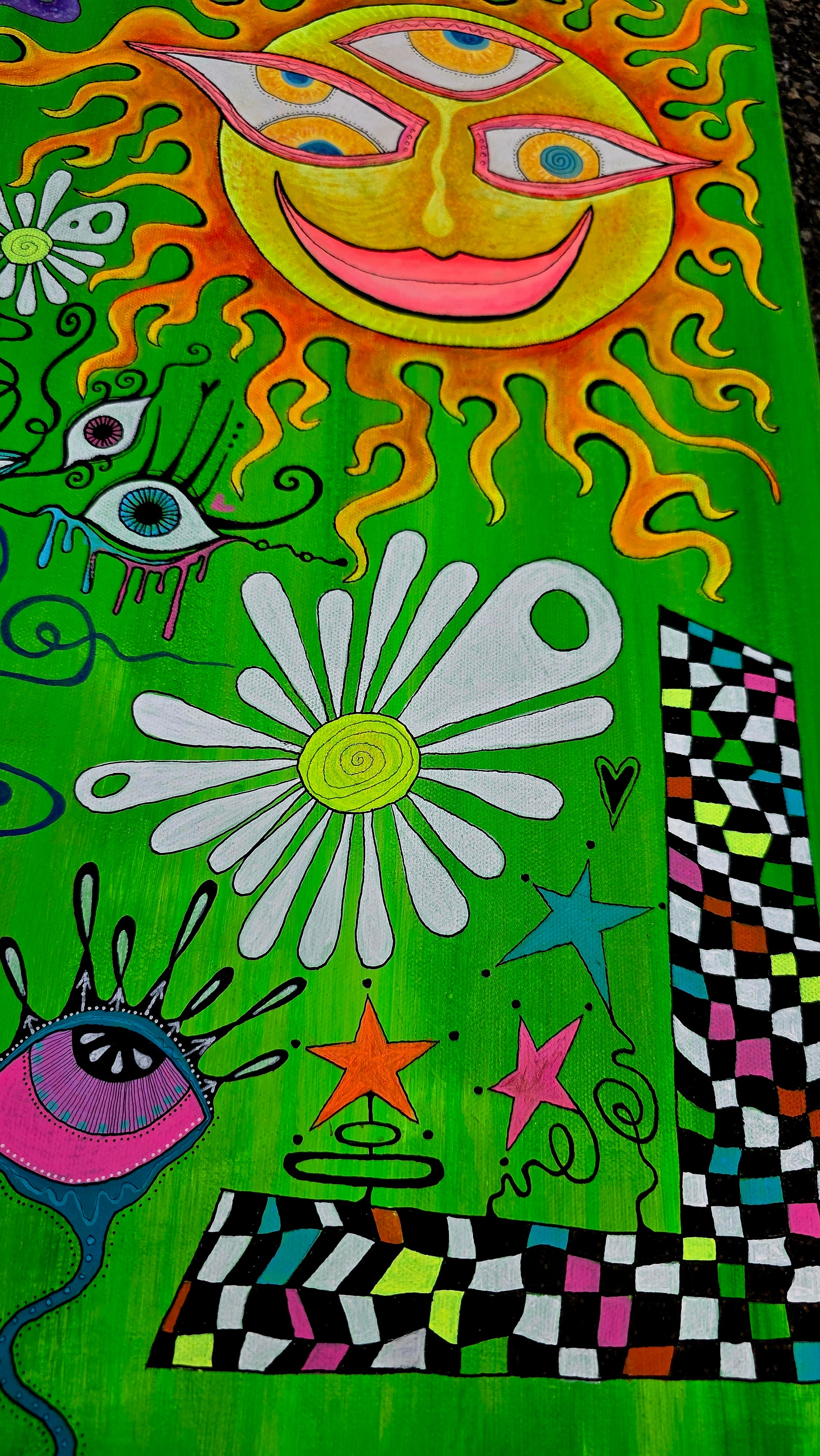 Colorful abstract design with sun, flowers, and eyes on a green background